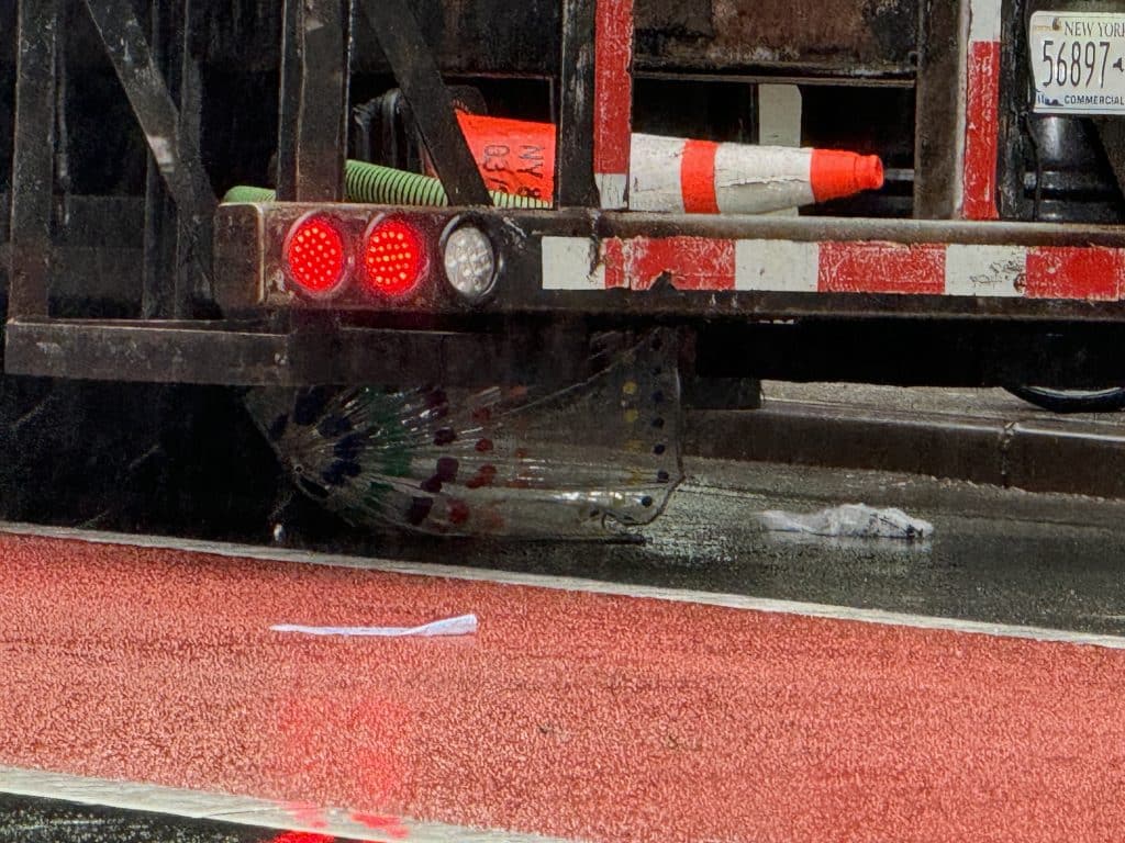 An umbrella remained wedged underneath the truck after striking a pedestrian, the fourth hit in just over a week | Upper East Site