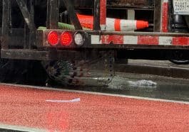 An umbrella remained wedged underneath the truck after striking a pedestrian, the fourth hit in just over a week | Upper East Site