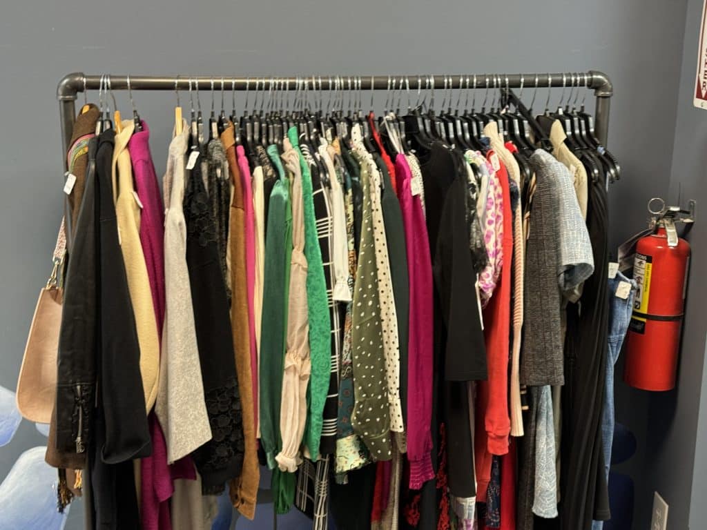 Pre-loved clothes donated to Goodwill stock the racks of their new Mini Shop | Upper East Site