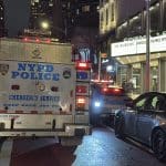 Photo shows an NYPD truck parked outside Cinema 123 where blood was found on the sidewalk