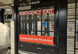 Photo shows a closeup of a subway emergency exit.