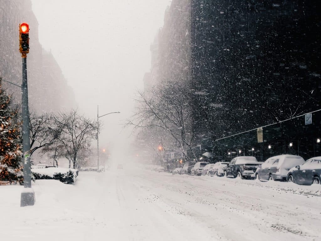 Photo shows snowy Madison Avenue during a snowstorm.