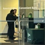 Photo shows police officers inside a bank.