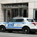 Photo shows an NYPD SUV parked outside Victoria's Secret store.
