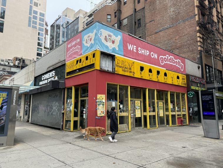 Photo shows Papaya King's red and yellow former storefront.