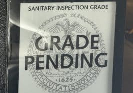 Photo shows a Health Department sign reading 'Grade Pending.'