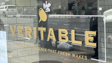 Photo shows a logo for 'VERITABLE' on a restaurant window.