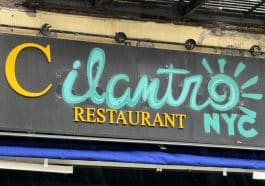 Photo shows a partially hand-drawn sign for Cilantro Restaurant NYC.
